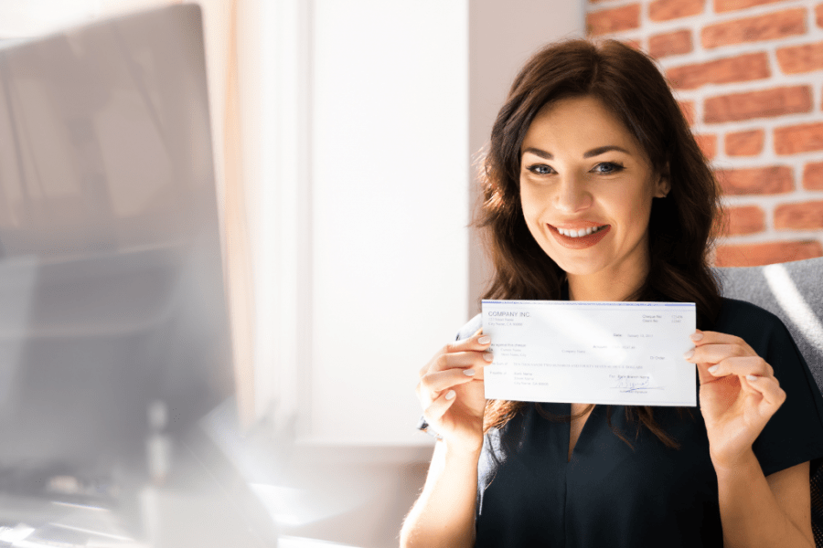 business woman showing payslip to streamline global payroll processes