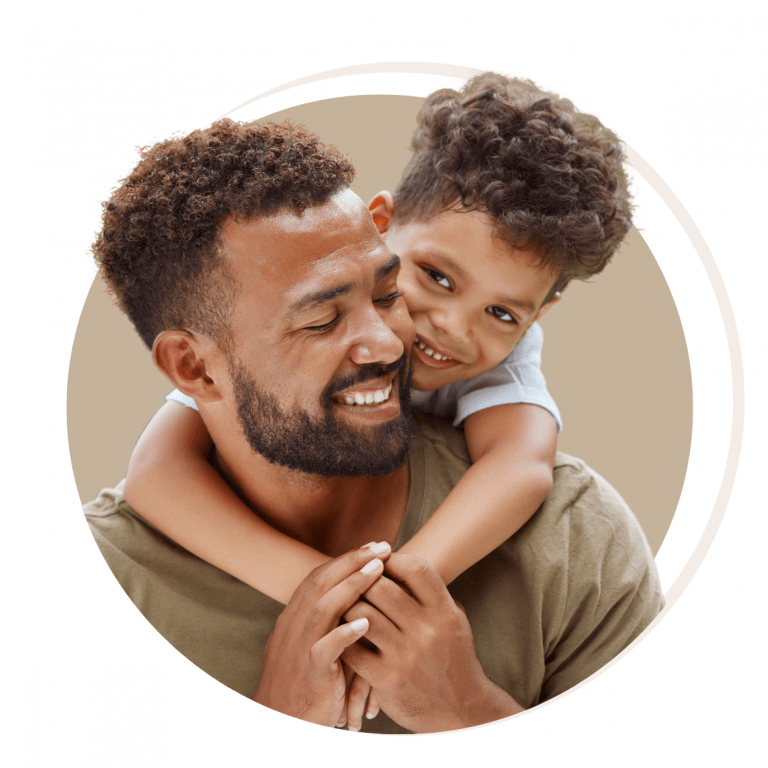 A joyful father embracing his son, celebrating a smooth relocation experience as an expat family settles into a new country with the help of comprehensive relocation services
